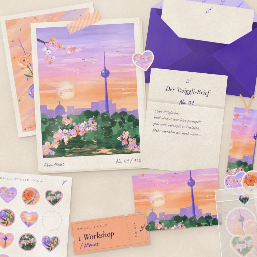 The contents of a Twiggli Letter laid out on paper: a painted art card of Berlin at dusk, a matching postcard and bookmark, a sheet of art stickers and the letter itself, beside a purple envelope with a wax seal.