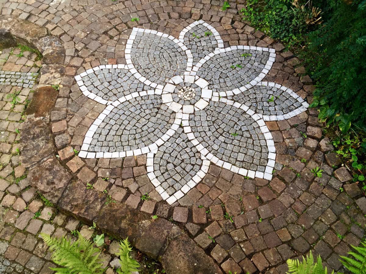 A lotus laid in stone in the courtyard